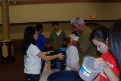 Alliance-volunteers-in-Houston-filling-AICB-buckets-for-flood-affected-families-in-Sinhd-Pakistan-1