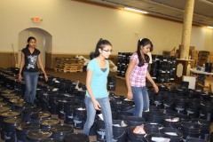 Container-send-off-Ceremony_Community-filling-AICB-buckets-4